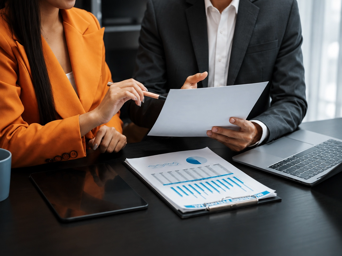 Metro Accounting Services team discussing financial reports with a small business client